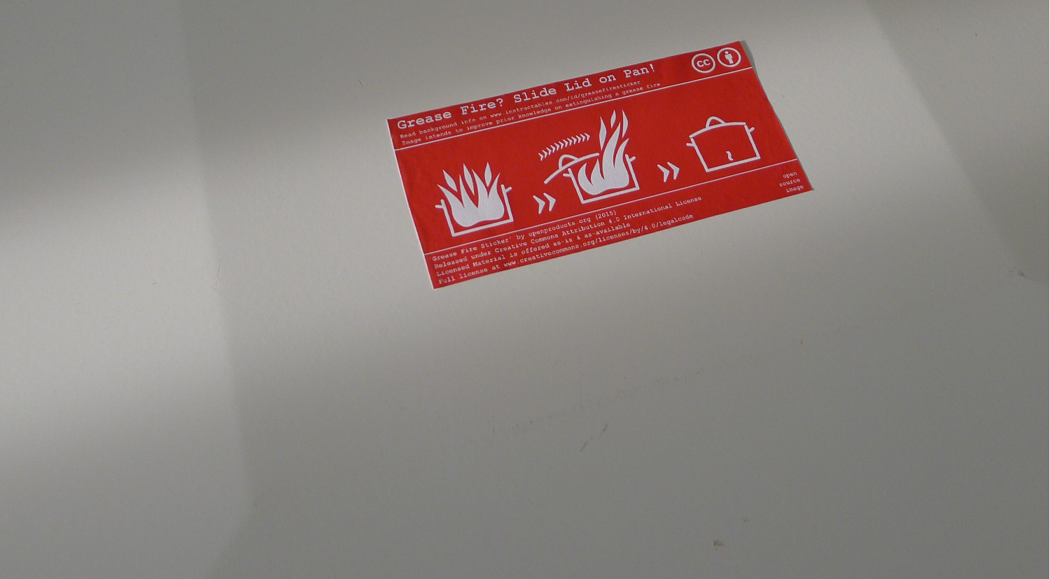 CC_BY_Openprodutcs_org_-_Grease_Fire_Sticker_on_Stove_Cover.jpg