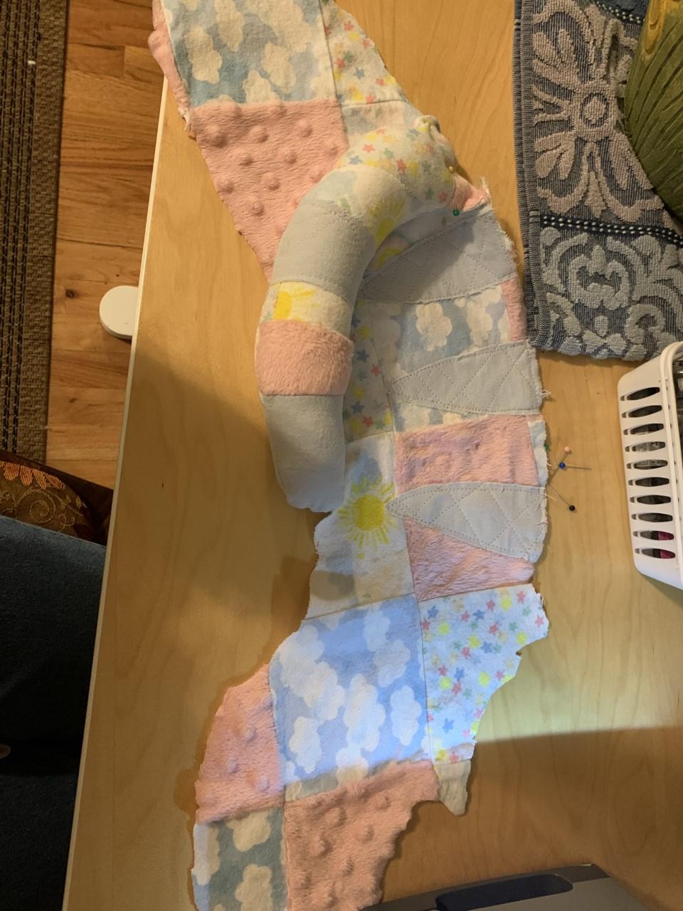 Sew tail opening closed then pin to right back.jpg