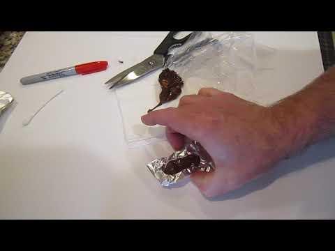 Tapping down the melted chocolate in the mold