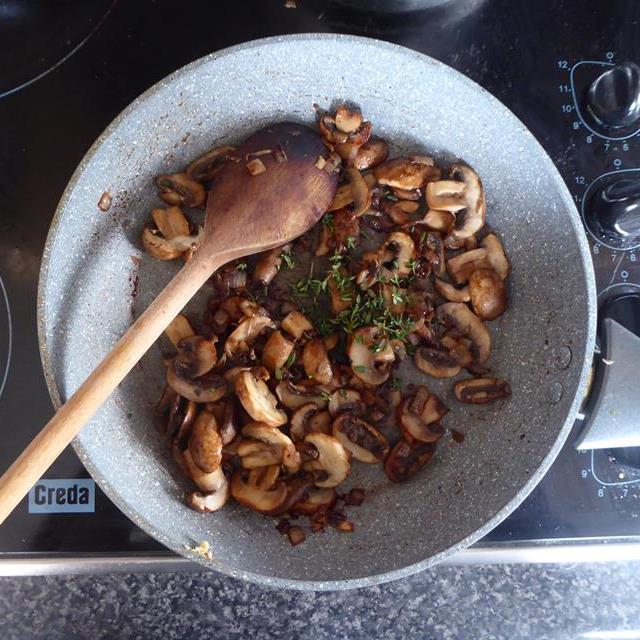 onions and mushrooms in blue frying pan cooked.JPG