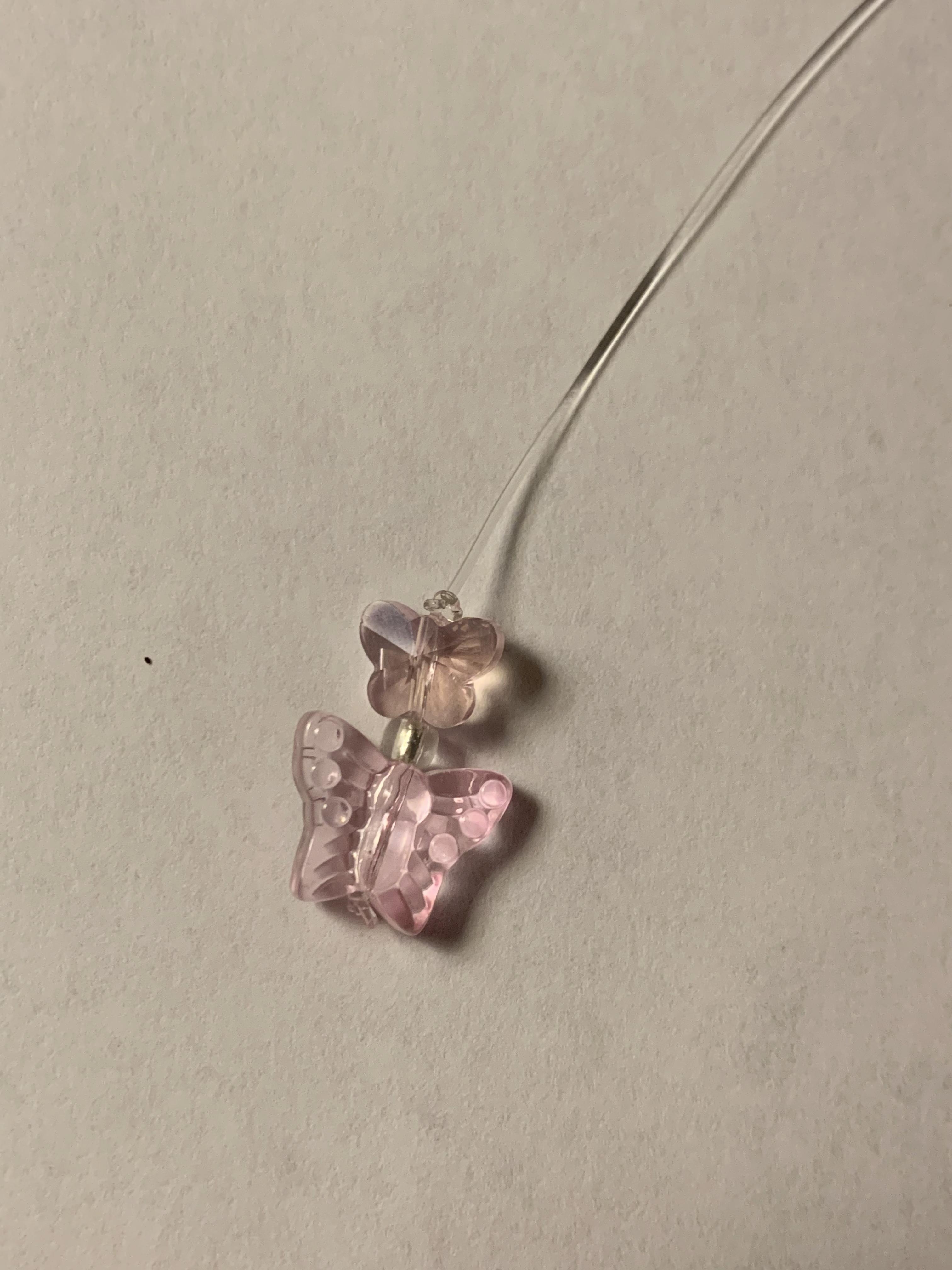 tie a knot above the strung beads.jpg