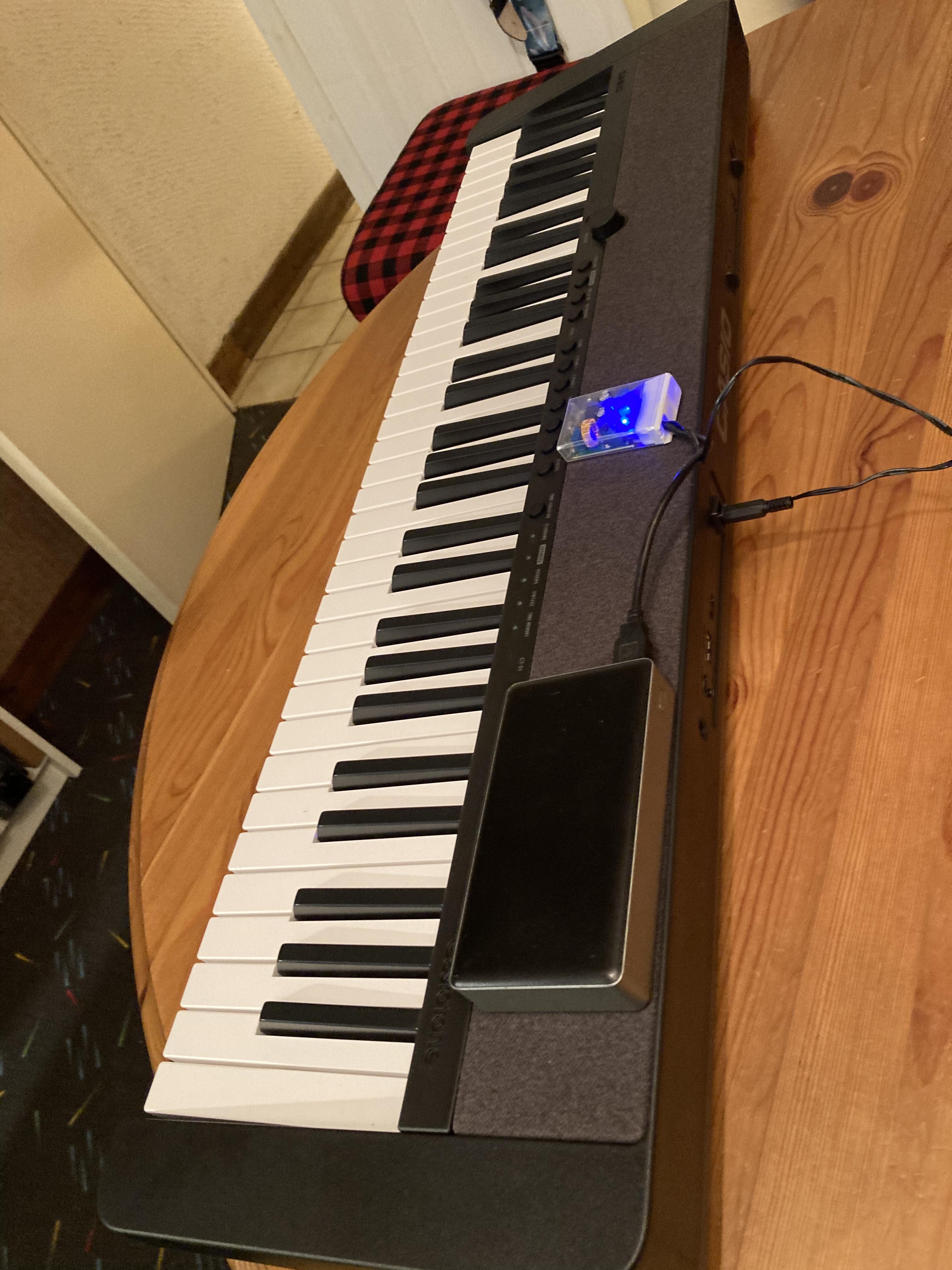 Powering my piano from a USB battery pack.