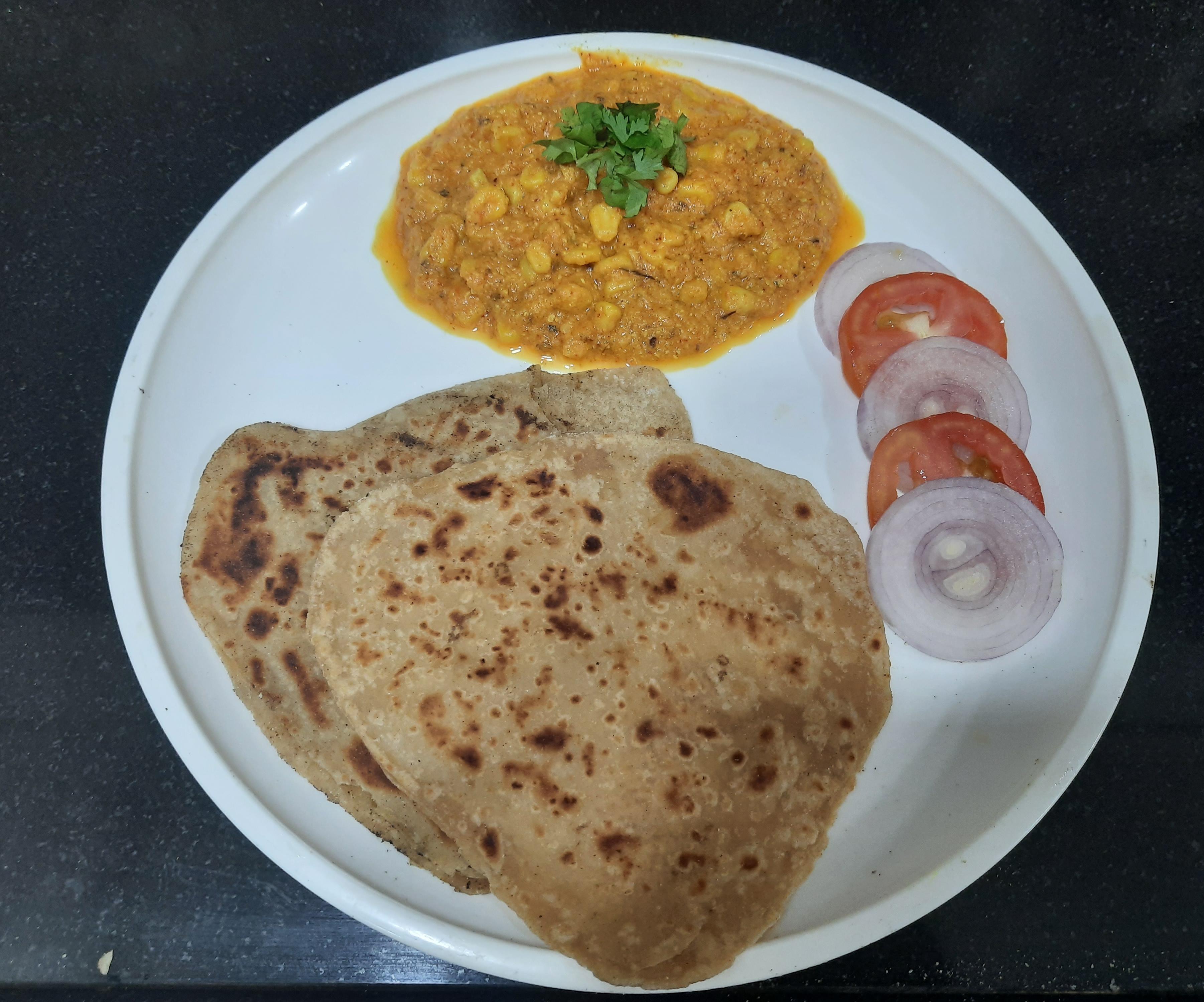 Sweet Corn Curry With Triangle Paratha