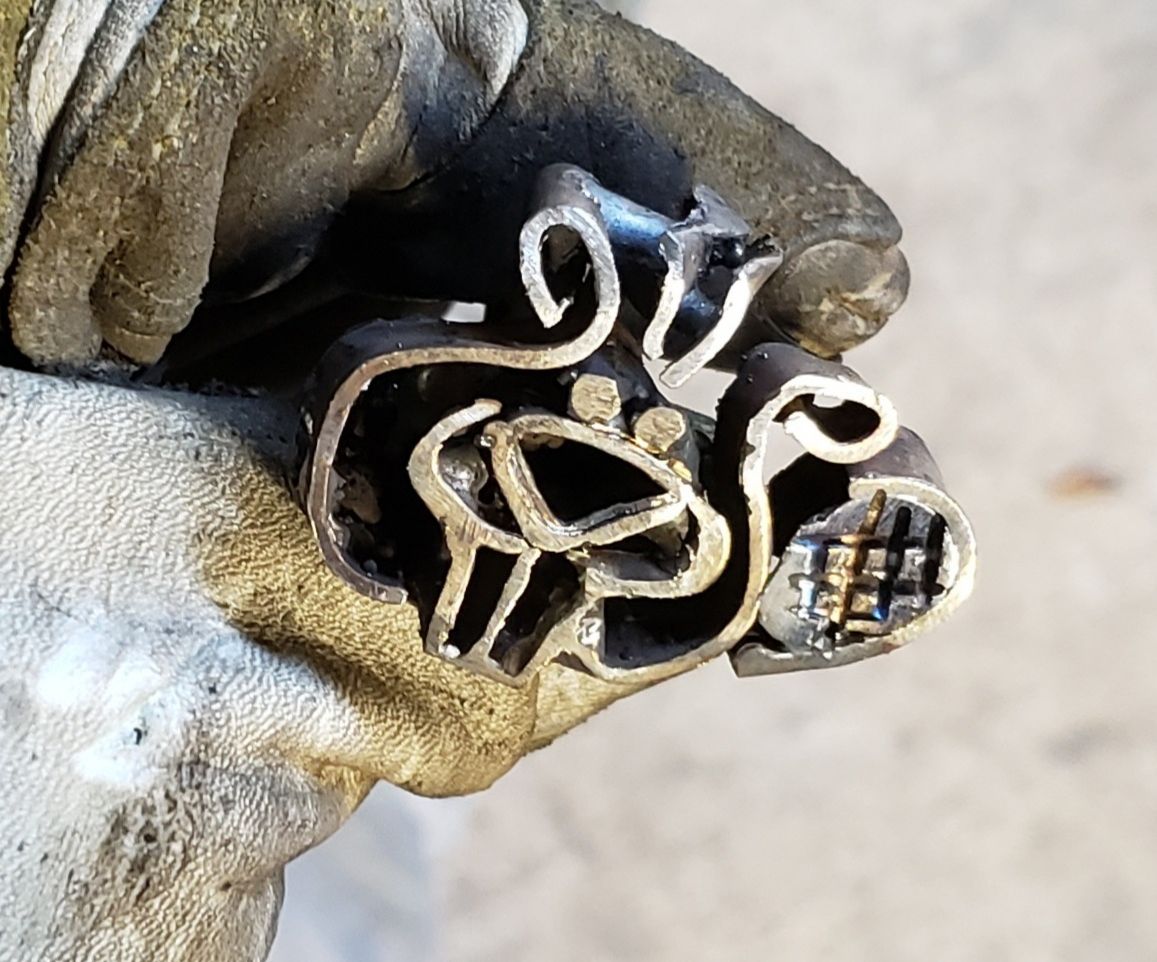 Tiny Branding Iron From a Cartoon