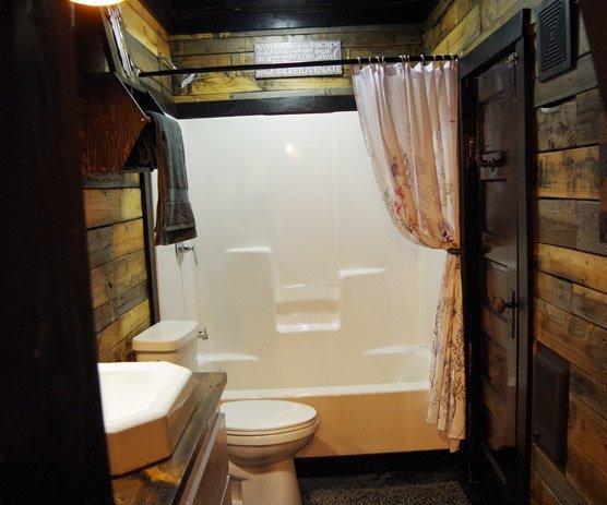 Basement Bathroom Reveal – Pallet Walls, Barn Wood and Black Floors!