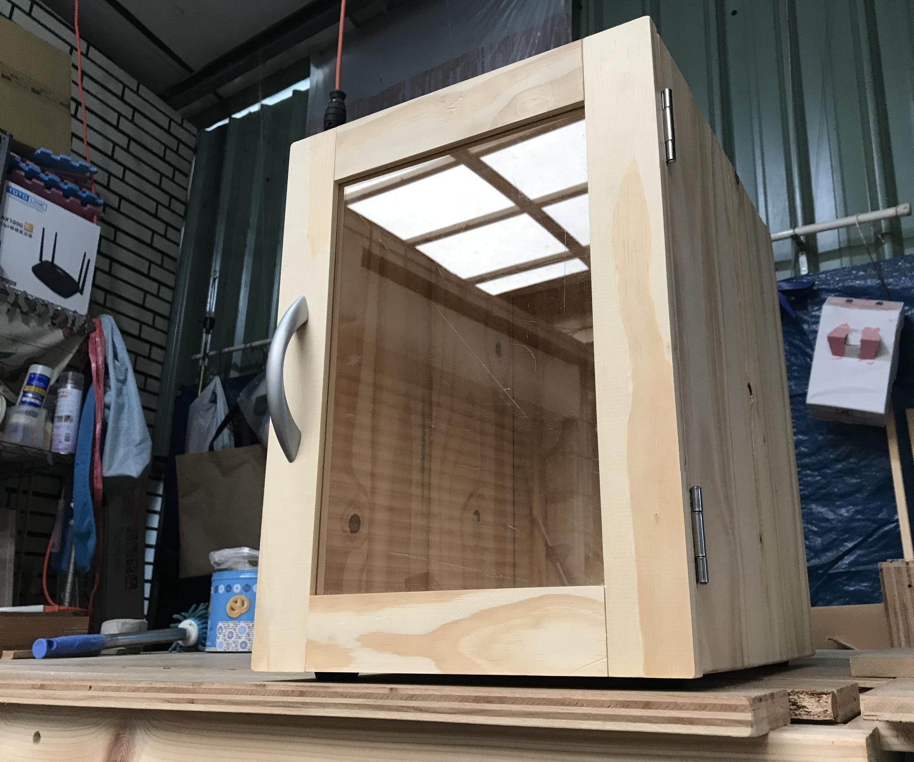 Homemade Small Cabinet With a Glass Door