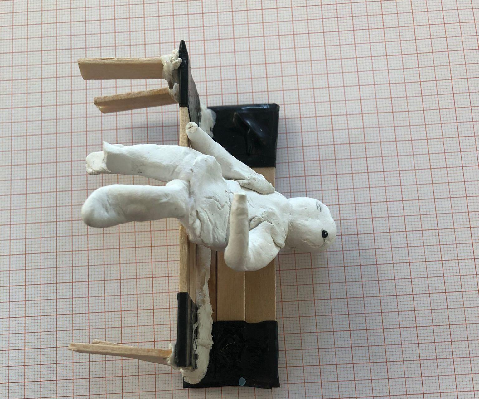 Guy sitting on a mini bench