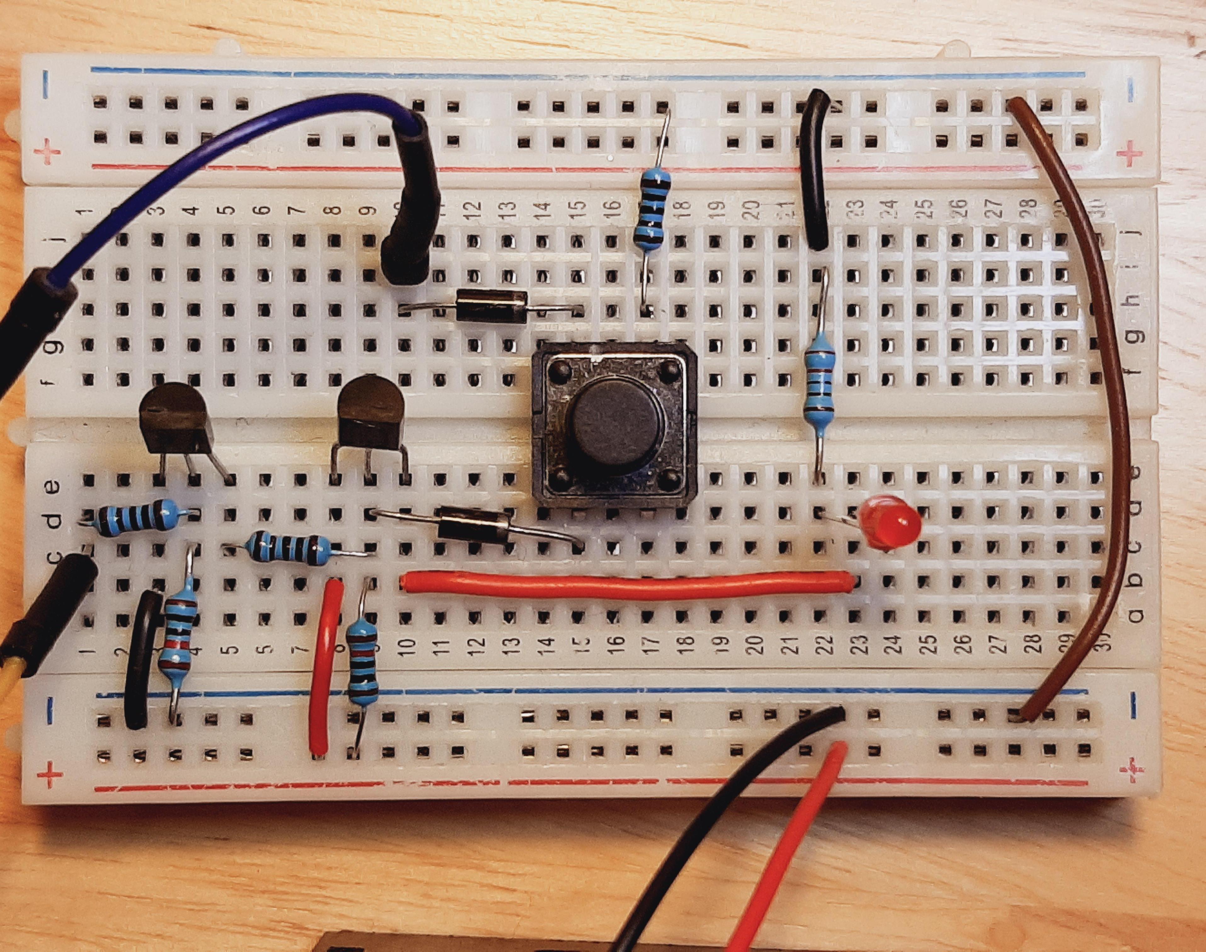 Bipolar Junctional Transistor (BJT) Latching Pushbutton On/Off Circuit