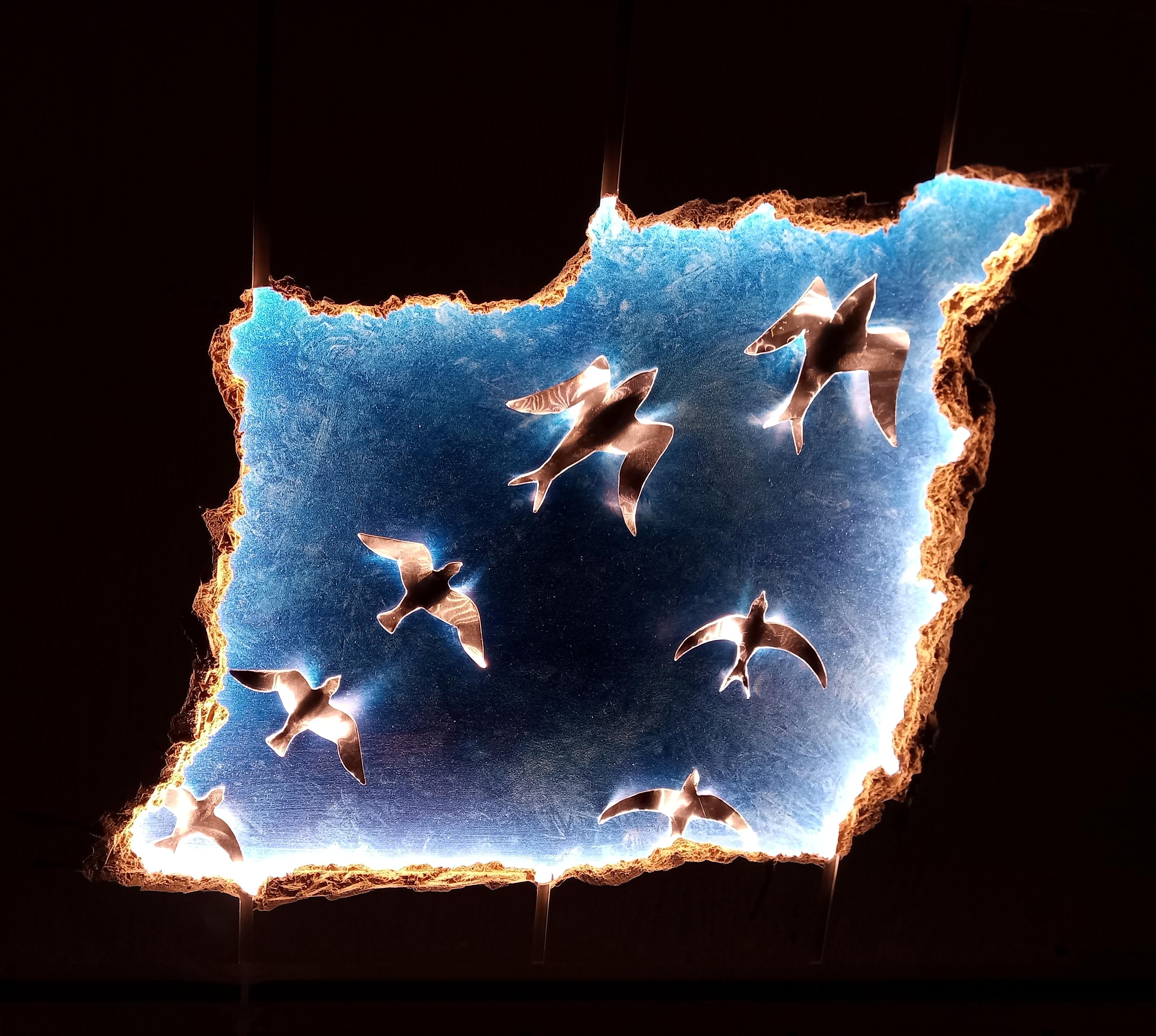 Ceiling Lighting: Illuminated Birds Seen Through a Fake Hole