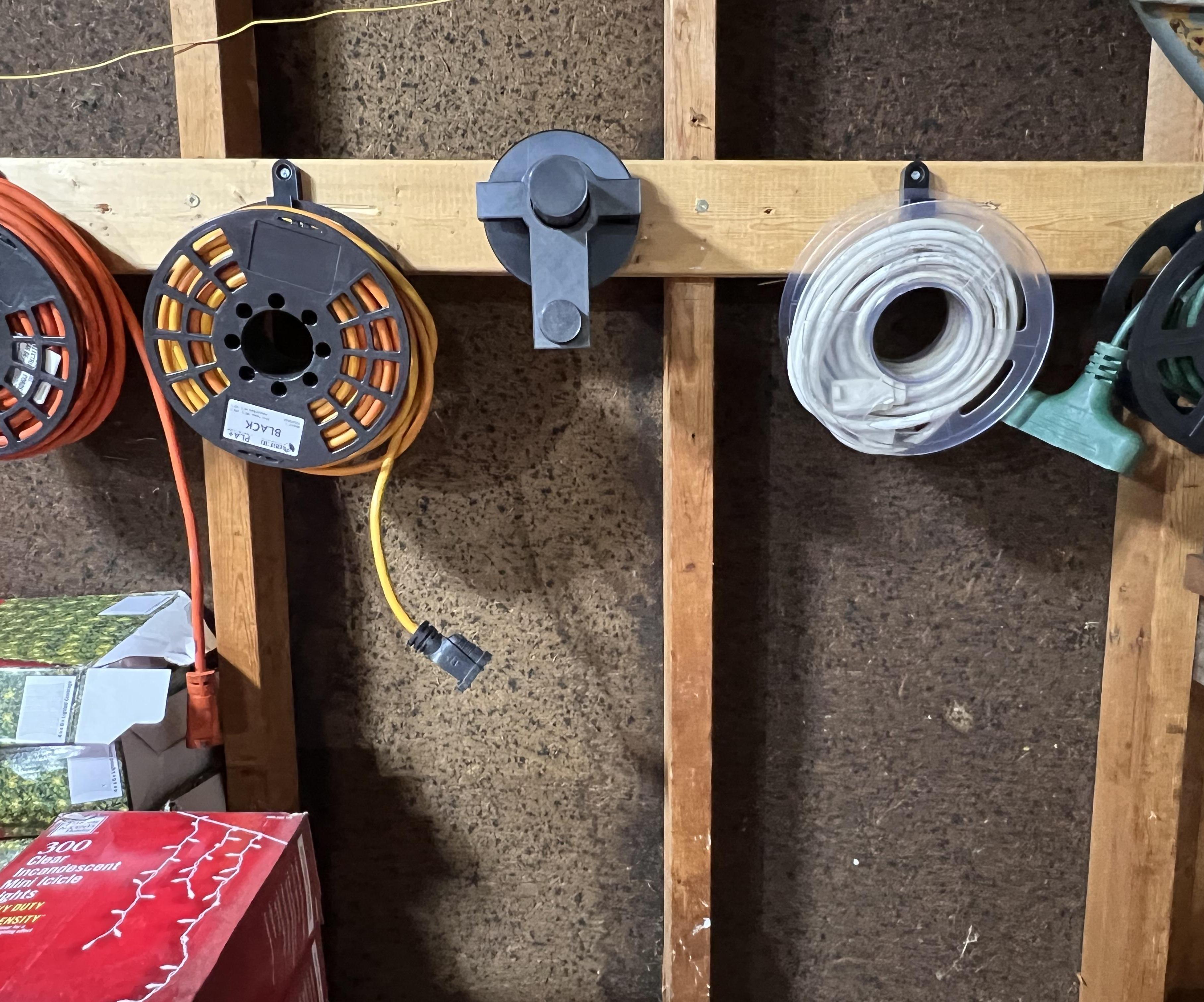 Extension Cord Rolling and Storage System Using Old Filament Spools